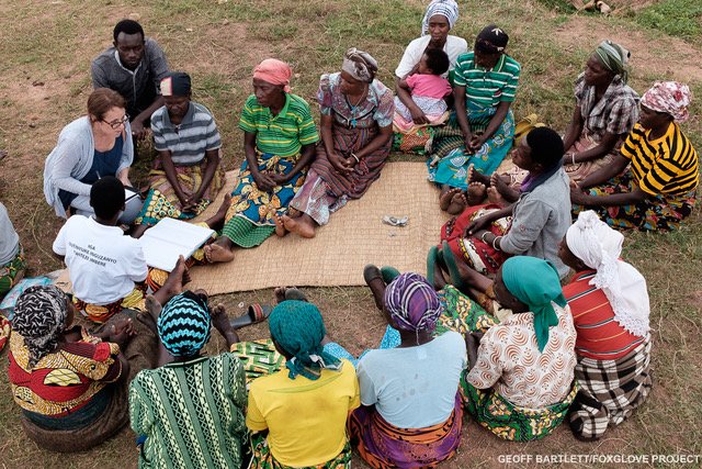 The weekly meeting of the seven Gakomeye self help groups. Here the women put into their group savings.