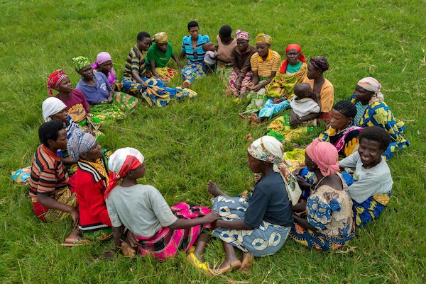 A newly formed self help group near Nyamagabe sit in a circle for the first time.